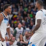 Minnesota Timberwolves guard Anthony Edwards (5) and forward Julius Randle (30) celebrate against the Sacramento Kings in the fourth quarter at Target Center.