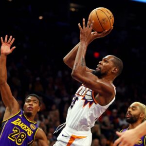 Phoenix Suns forward Kevin Durant (35) shoots the ball against Los Angeles Lakers forward Rui Hachimura (28) during the second half at Footprint Center.