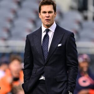 Former quarterback and current NFL announcer Tom Brady looks on before the game between the Chicago Bears and Green Bay Packers at Soldier Field.