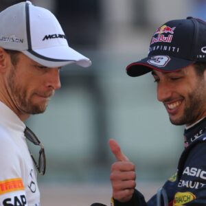 Jenson Button (GBR) McLaren Mercedes MP4-29 and Daniel Ricciardo (AUS) Red Bull Racing RB10 Abu Dhabi Grand Prix