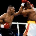 Mike Tyson (black trunks) battles Donovan Ruddock (white trunks) during their heavyweight fight at The Mirage. Tyson defeated Ruddock by TKO in round 7.