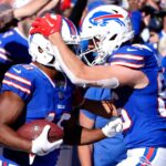 Oct 20, 2024; Orchard Park, New York, USA; Buffalo Bills tight end Dalton Kincaid (86) congratulates Buffalo Bills wide receiver Amari Cooper (18) for scoring a touchdown against the Tennessee Titans during the second half at Highmark Stadium.