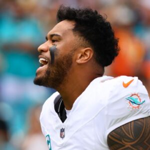 Miami Dolphins quarterback Tua Tagovailoa (1) reacts as he enters the field before the game against the Arizona Cardinals at Hard Rock Stadium.