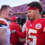 Denver Broncos quarterback Bo Nix (10) talks with Kansas City Chiefs quarterback Patrick Mahomes (15) after the game at GEHA Field at Arrowhead Stadium.