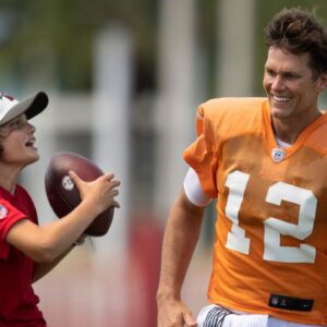 Tampa Bay Buccaneers quarterback Tom Brady (12) watches his son Jack pull in a catch after their joint training camp practice against the Tennessee Titans at AdventHealth Training Center Thursday, Aug. 19, 2021 in Tampa, Fla. Nas Titans Bucs 037