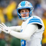 Detroit Lions quarterback Jared Goff (16) throws a pass during warmups prior to the game against the Green Bay Packers at Lambeau Field.