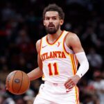 Atlanta Hawks guard Trae Young (11) brings the ball up court against the Chicago Bulls during the second half at United Center