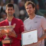 Novak Djokovic (SRB) and Andy Murray (GBR) pose with their trophies at the presentation on day 15 of the 2016 French Open.