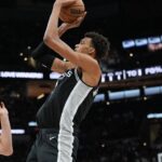 San Antonio Spurs center Victor Wembanyama (1) shoots over Utah Jazz forward Lauri Markkanen (23) in the second half at Frost Bank Center.