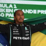 Lewis Hamilton of Great Britain and team Mercedes with the Brazilian flag to honor his hero Ayrton Senna