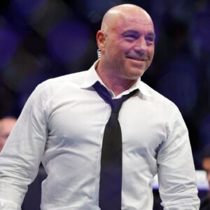 Joe Rogan after the fight between Amir Albazi (red gloves) and Francisco Figueiredo (blue gloves) during UFC 278 at Vivint Arena.