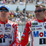 NASCAR Cup Series driver Kevin Harvick (left) sits on the pit wall with crew chief Rodney Childers (right) prior to the Overton's 400 at Pocono Raceway.