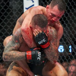 Dustin Poirier (red gloves) and Michael Chandler (blue gloves) during UFC 281 at Madison Square Garden.