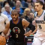 Los Angeles Clippers guard Chris Paul (3) dribbles in the second quarter against the Minnesota Timberwolves guard Zach LaVine (8) at Target Center.