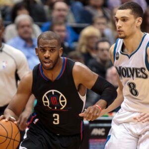 Los Angeles Clippers guard Chris Paul (3) dribbles in the second quarter against the Minnesota Timberwolves guard Zach LaVine (8) at Target Center.