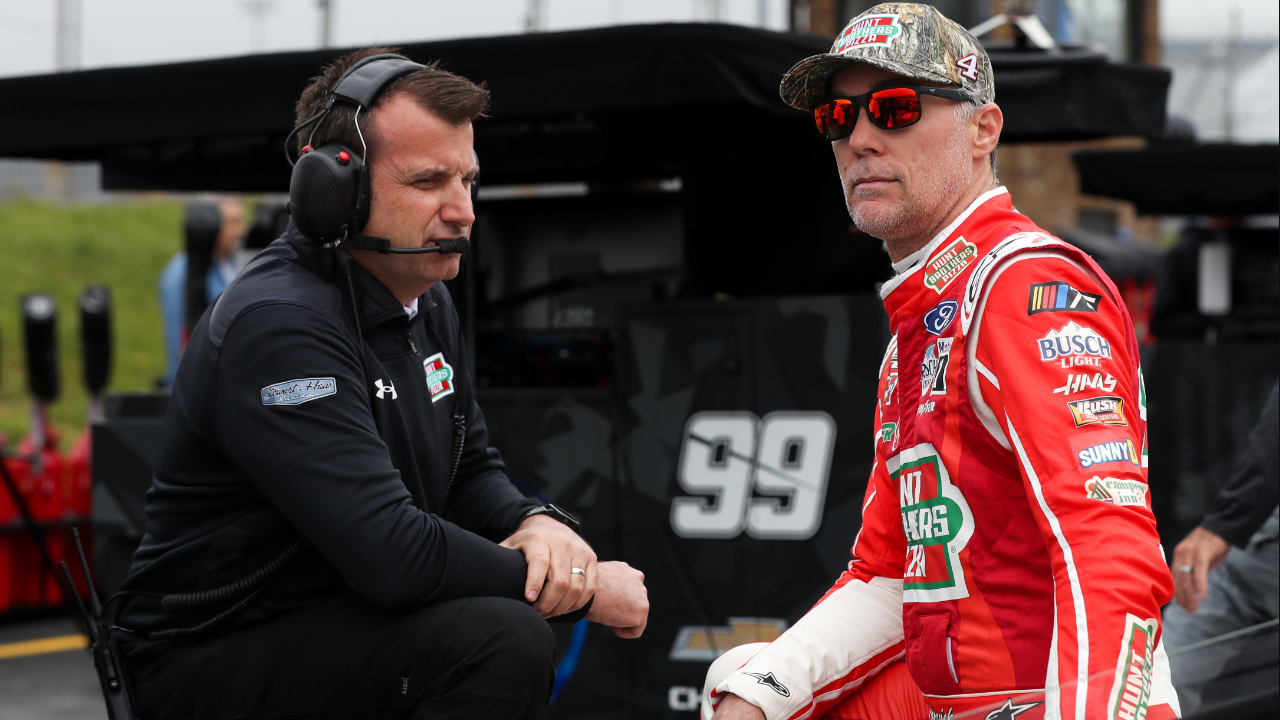 Former NASCAR Cup Series driver Kevin Harvick (right) talks with his crew chief Rodney Childers (left) on pit road during practice and qualifying for the Wurth 400 at Dover Motor Speedway.
