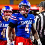 Kansas running back Devin Neal (4) reacts after scoring a touchdown during the 3rd quarter between the Kansas Jayhawks and the Colorado Buffaloes at GEHA Field at Arrowhead Stadium.