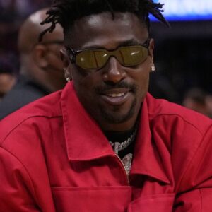 Former NFL player Antonio Brown stands on the court during halftime of the game between the Miami Heat and the Brooklyn Nets at FTX Arena.