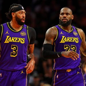 Los Angeles Lakers forward Anthony Davis (3) and forward LeBron James (23) walks to the bench during the first half against the Phoenix Suns at Footprint Center.