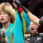 Shavkat Rakhmonov (red gloves) reacts after defeating Stephen Thompson (blue gloves) during UFC 296 at T-Mobile Arena.
