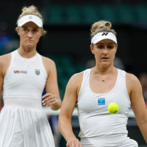 Gabriela Dabrowski (CAN)(R) and Erin Routliffe (NZL)(L) on court between points against Taylor Townsend (USA) and Katerina Siniakova (CZE)(both not pictured) in the ladies' doubles final of The Championships Wimbledon 2024