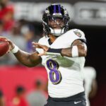 Baltimore Ravens quarterback Lamar Jackson (8) warms up before a game against the Tampa Bay Buccaneers at Raymond James Stadium.