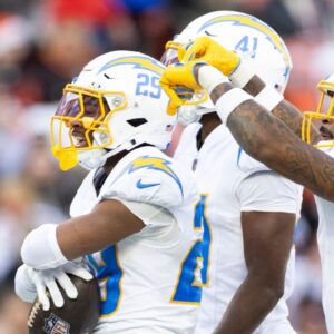 Los Angeles Chargers cornerback Tarheeb Still (29) celebrates his interception with safety Derwin James Jr. (3) and cornerback Eli Apple (41) during the fourth quarter against the Cleveland Browns at Huntington Bank Field.