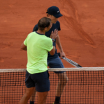 Rafael Nadal (ESP) at the net with Jannik Sinner (ITA)