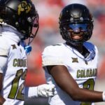 Oct 19, 2024; Tucson, Arizona, USA; Colorado Buffalos quarterback Shedeur Sanders (2) with wide receiver Travis Hunter (12) against the Arizona Wildcats at Arizona Stadium.