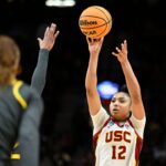 USC Trojans guard JuJu Watkins (12) shoots a jump shot during the second half against Baylor Lady Bears guard Darianna Littlepage-Buggs (5) in the semifinals of the Portland Regional of the 2024 NCAA Tournament at the Moda Center.
