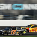 Monster Energy NASCAR Cup Series driver Martin Truex Jr. (78) laps driver Joey Logano (22) during the ISM Connect 300 at the New Hampshire Motor Speedway.