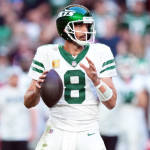 New York Jets quarterback Aaron Rodgers (8) passes against the Arizona Cardinals during the second half at State Farm Stadium.