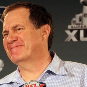 Patriots head coach Bill Belichick smiles during a question during a press conference at the Patriots hotel in downtown Indianapolis.