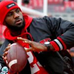 Cleveland Cavaliers player LeBron James plays catch with the Ohio State Buckeyes team before the game against the Michigan Wolverines at Ohio Stadium.
