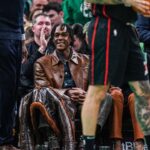 Former Boston Celtics player Rajon Rondo on the sideline as the Celtics take on the Detroit Pistons in the second half at TD Garden
