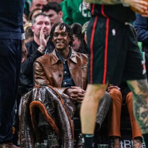 Former Boston Celtics player Rajon Rondo on the sideline as the Celtics take on the Detroit Pistons in the second half at TD Garden