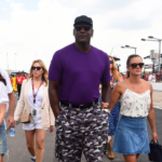 NASCAR Cup Series 23XI Racing owner Michael Jordan walks pit road with his wife Yvette Prieto during qualifying for the Ally 400 at Nashville Superspeedway.