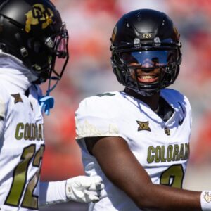 Oct 19, 2024; Tucson, Arizona, USA; Colorado Buffalos quarterback Shedeur Sanders (2) with wide receiver Travis Hunter (12) against the Arizona Wildcats at Arizona Stadium.