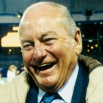 St. Louis Cardinals owner Bill Bidwill (left) talks with Dallas Cowboys general manager Tex Schramm (right) on the field at Busch Stadium
