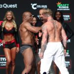 Mike Tyson (left) slaps Jake Paul (right) after weighing in at the Toyota Music Factory.