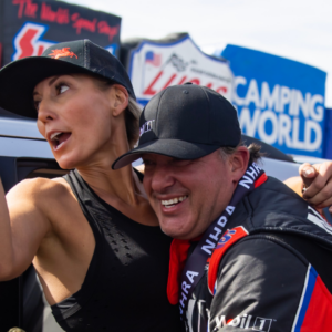 NHRA top alcohol dragster driver Tony Stewart (right) celebrates with wife Leah Pruett after winning the Four Wide Nationals at The Strip at Las Vegas Motor Speedway.