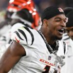 Cincinnati Bengals wide receiver Ja'Marr Chase (1) walks with a chain around his neck on the sidelines after scoring a touchdown during the second half against the Baltimore Ravens at M&T Bank Stadium.