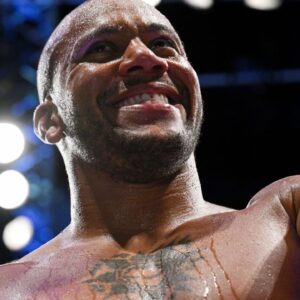 Ciryl Gane (red gloves) leaves the arena after defeating Serghei Spivac (blue gloves) during UFC Fight Night at Accor Arena.