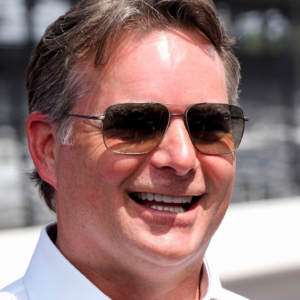 Inaugural Brickyard 400 winner Jeff Gordon stands on the track with other drivers from the first race Sunday, July 21, 2024, ahead of the Brickyard 400 at Indianapolis Motor Speedway.