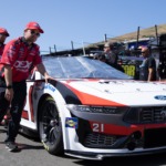 Pit crews for NASCAR Cup Series driver Harrison Burton (21) pushes out the race vehicle before the start of the Toyota / Save Mart 350 at Sonoma Raceway.