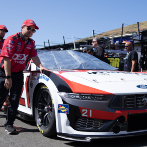 Pit crews for NASCAR Cup Series driver Harrison Burton (21) pushes out the race vehicle before the start of the Toyota / Save Mart 350 at Sonoma Raceway.