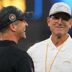 Baltimore Ravens coach John Harbaugh with brother and Los Angeles Chargers coach Jim Harbaugh before the game at SoFi Stadium.