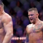 Dustin Poirier (red gloves) defeats Michael Chandler (blue gloves) during UFC 281 at Madison Square Garden.