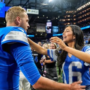 Detroit Lions quarterback Jared Goff hugs his wife Christen Harper during warmups before the Los Angeles Rams game at Ford Field in Detroit.