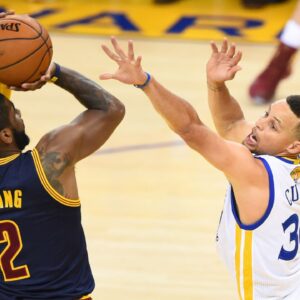 Cleveland Cavaliers guard Kyrie Irving (2) shoots against Golden State Warriors guard Stephen Curry (30) defends during the first half in game two of the NBA Finals at Oracle Arena.
